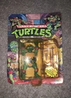 Vintage Playmates TMNT Raphael Action Figure Carded w/ Sai Kama Ninja Stars