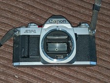 CANON AV-1, 35mm SLR FILM CAMERA, TESTED AND WORKING, INCLUDES BATTERY.