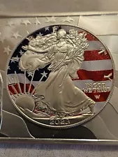 2023-W silver eagal colorized and housed in an 2 once silver bar.