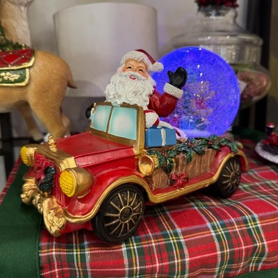 Spieluhr ''Schneekugel'' Weihnachtsmann im Auto mit Musik und Licht - Henriette