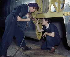 Rivet gun bucking bar are tools of riveting team Here two Convair - Old Photo