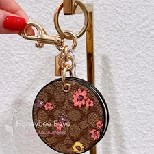 NWT Coach Mirror Bag Charm In Signature Canvas With Spaced Floral Print CA046