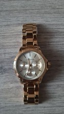 COOXHOR Montre femme quartz analogique or rose date cadran argenté ronde neuf