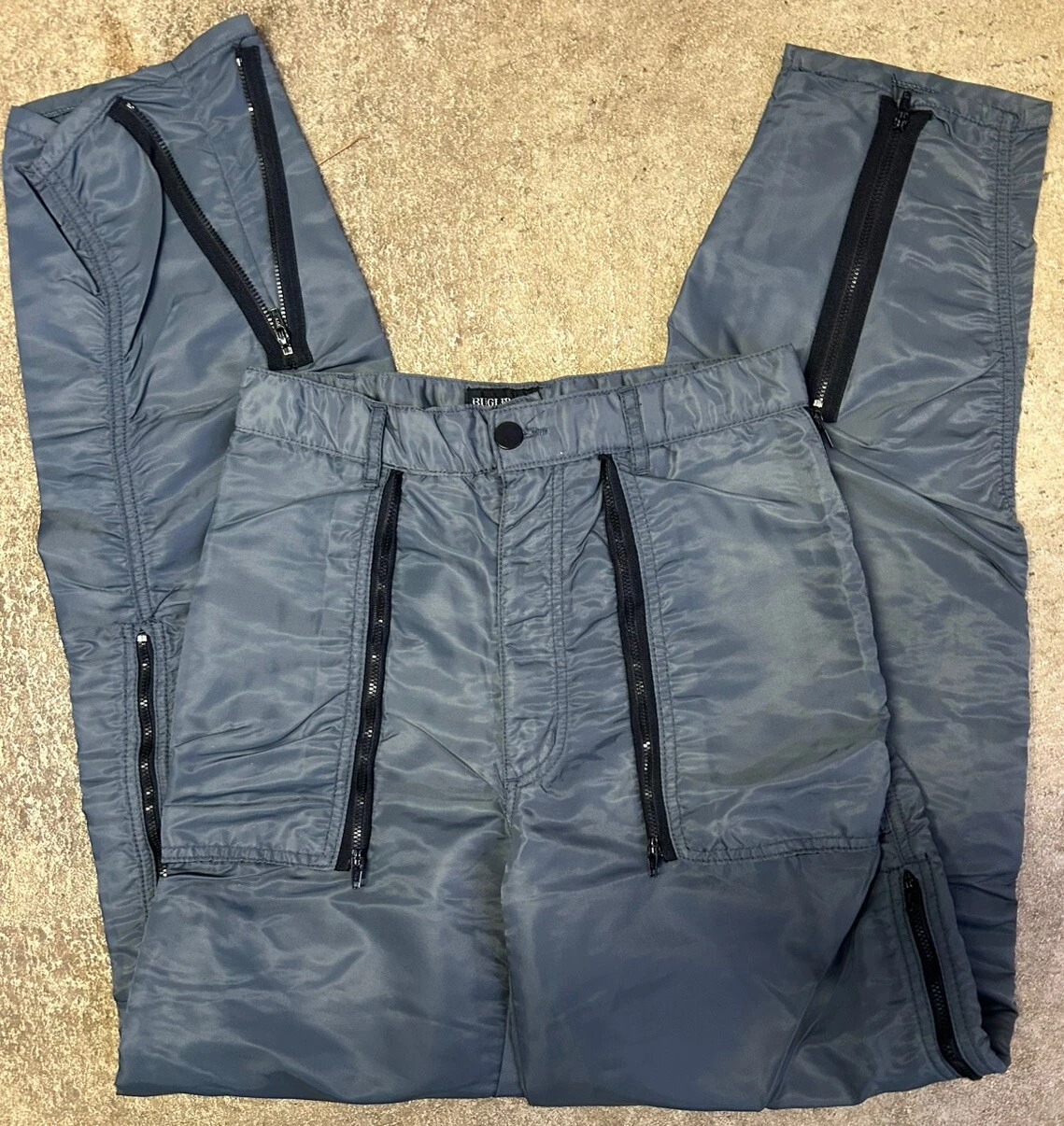Vintage gray Bugle Boy Countdown parachute pants from the 1980s with multiple black zippers