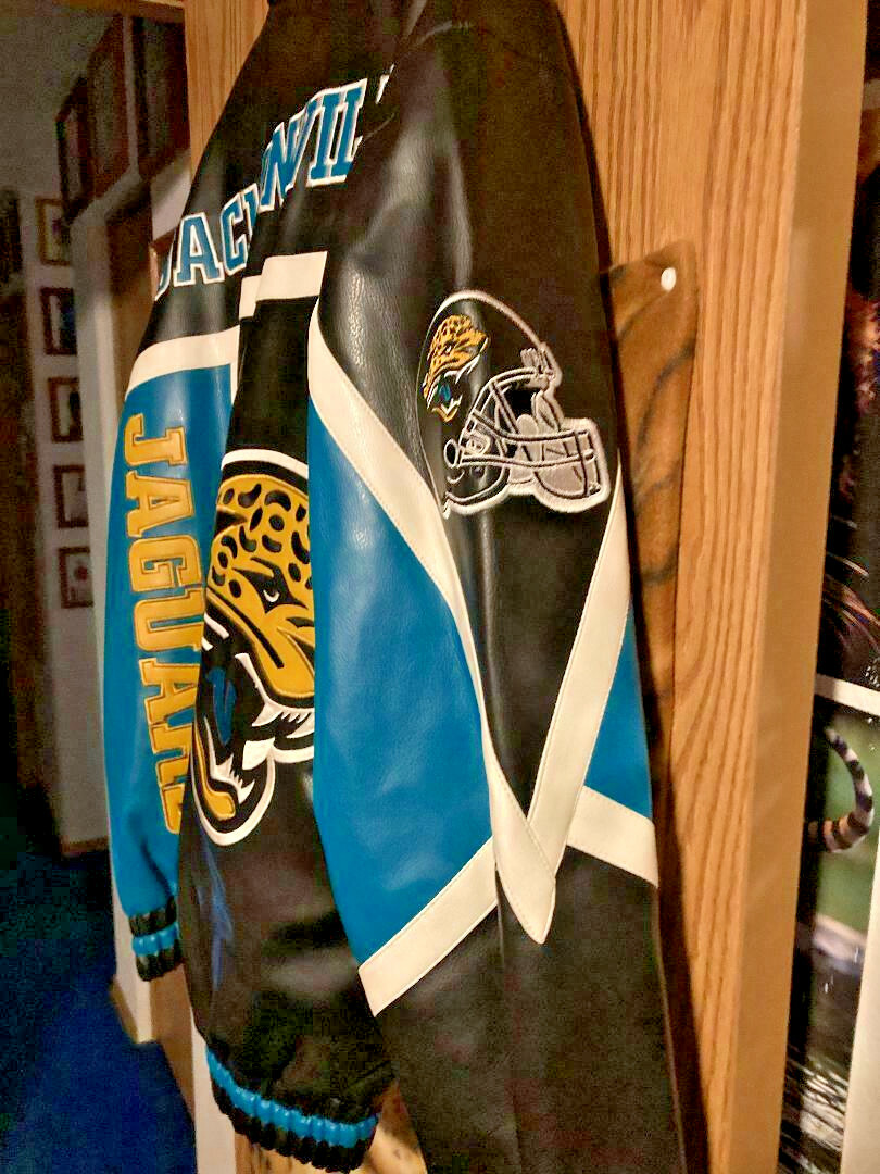 NIP MEN'S NFL JACKSONVILLE JAGUARS FAUX LEATHER VARSITY NIP MEN'S NFL JACKSONVILLE JAGUARS FAUX LEATHER VARSITY