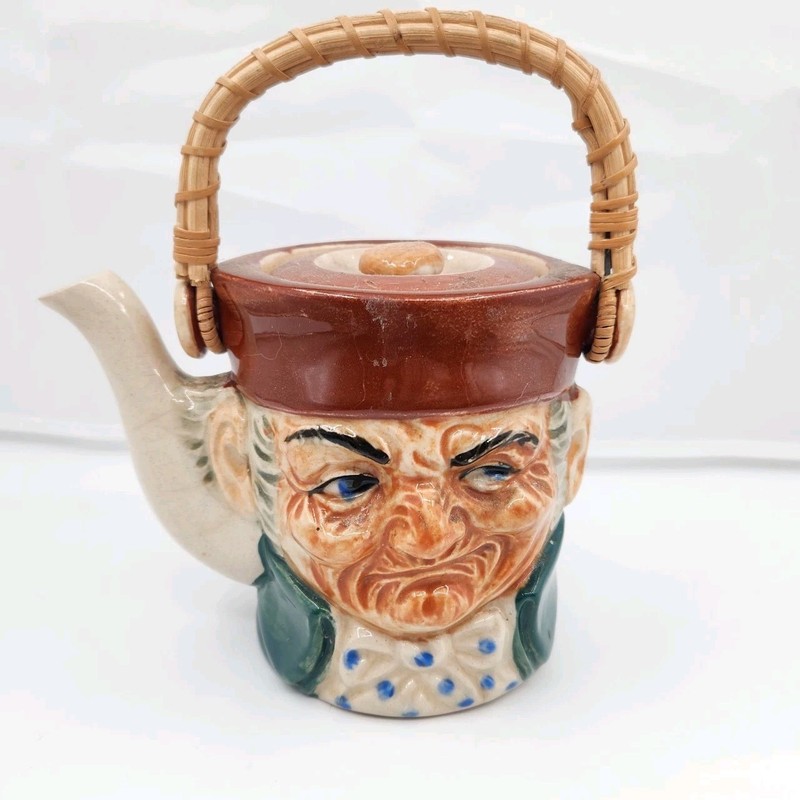 Toby Style Tea Pot England marking MT Man Winking wicker handle