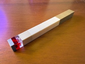  LEGO Inspired Cigarette has a tan filter and a grey, clear and red ashes