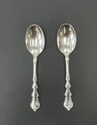 International Sterling "Angelique" pair of spoons 6 3/4 in