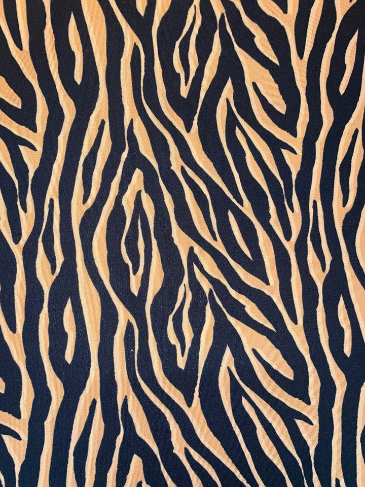 TELA DE VESTIDO CREPE CON ESTAMPADO DE TIGRE ANIMAL NEGRO/NARANJA CLARO 58"" DE ANCHO Foto 4 de 4