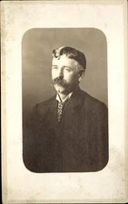 RPPC man in suit tie with very long mustache ~ ARTURA real photo 1908-1924