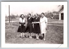 Vtg B&W Snapshot Four Sisters In Mid Century Dresses Standing In A Yard 1946