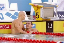 Alexander Popov of Russia and Michael Klim hug each other at the W- Old Photo