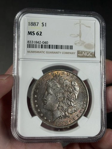 1887 Morgan Silver Dollar NGC MS62 Orange/Purple Toning