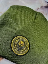 DAMIER LANGEVINÈ® SIGNATURE LION EMBLEM DESIGNER BEANIE SKULLY OLIVE HAT OS