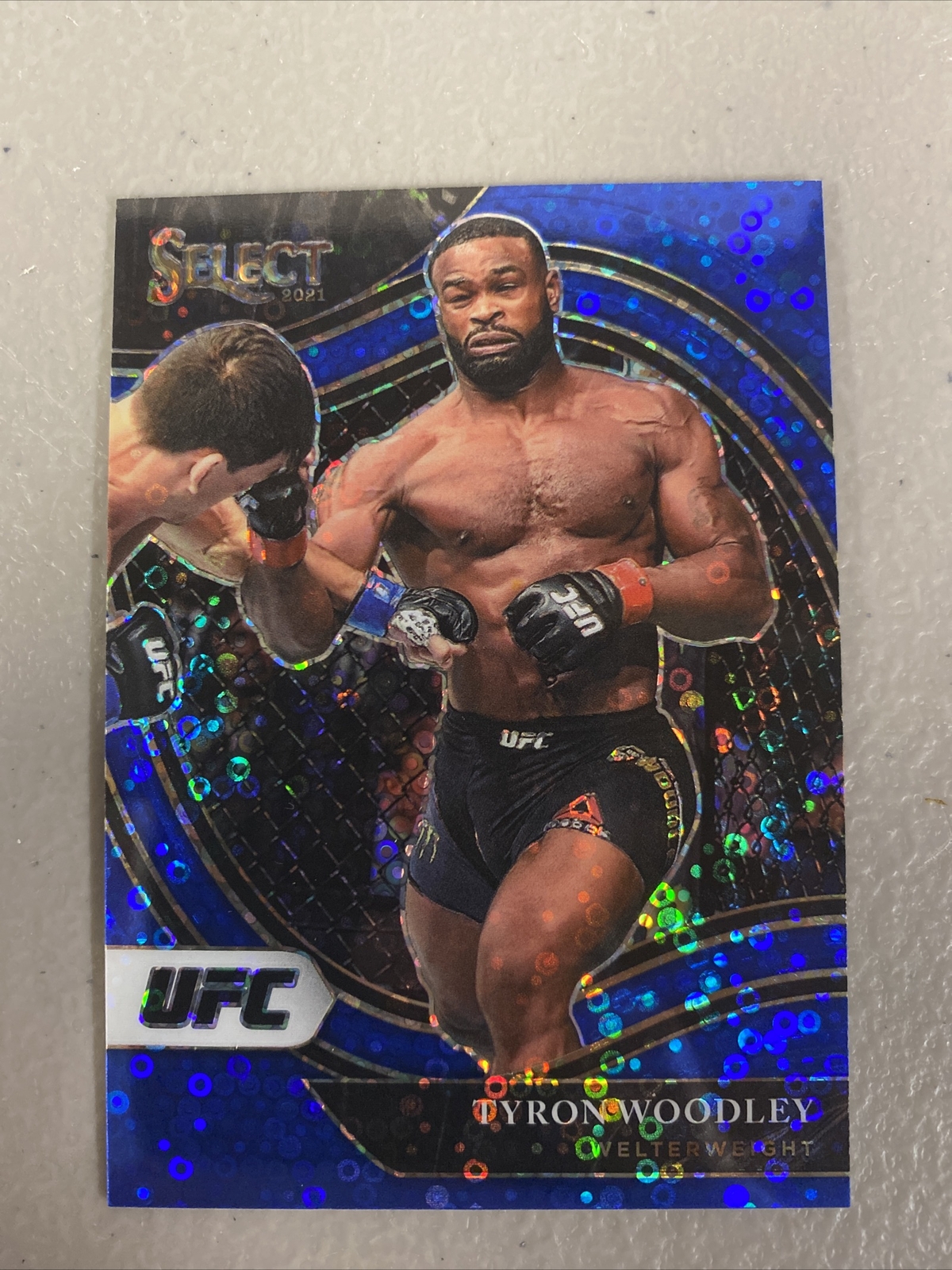 Tyron Woodley 2021 Select UFC Octagonside Blue Disco Prizm Parallel 84/99