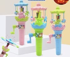 Children's glowing and flashing hand-cranked carousel, luminous