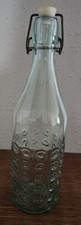 vintage turquoise-tinted swing-top glass bottle with a distinctive textured ring