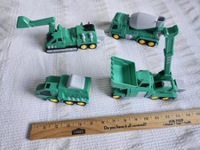 4 of the five green Laradola 5-in-1 Transform Robot Construction Vehicle