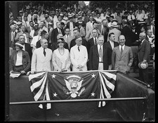 [Group in presidential stand; Lou Hoover and Herbert Hoover, front row]