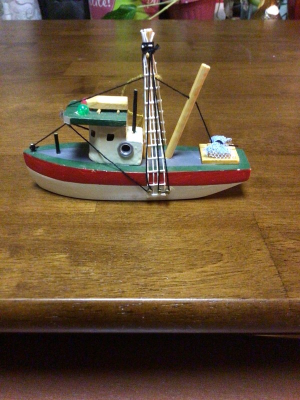 Vintage Wood Fishing Boat Approximately 5” is a hanging Christmas Ornament