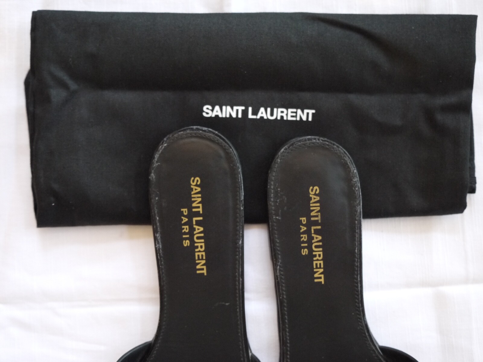 Diapositive brevetto tributo Saint Laurent