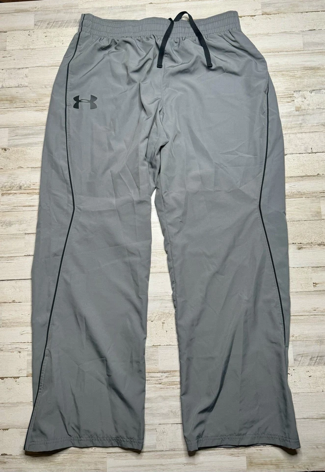 Pantalones cortavientos Under Armour para hombre XL gris forrados de malla bolsillos con cremallera pista Foto 2 de 4