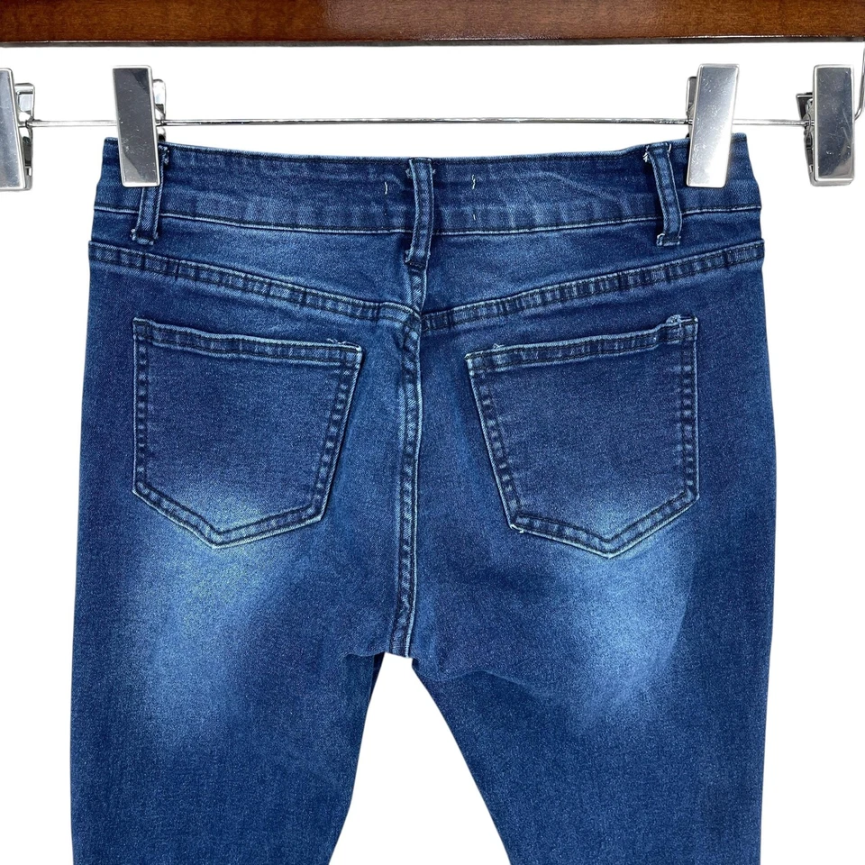 Jeans acampanados de bambú talla 7 azul grunge desgastado dobladillo crudo elástico denim Foto 3 de 4