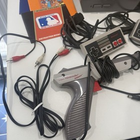Nintendo NES Console Bundle + 11 Games Mario NFL Controllers Gun Cords Booklets