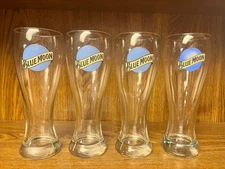 4 tall Blue Moon pilsner style glasses