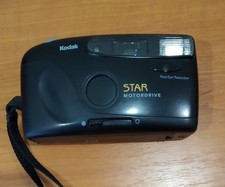 Kodak Star Motordrive 35mm camera with flash with red-eye reduction.