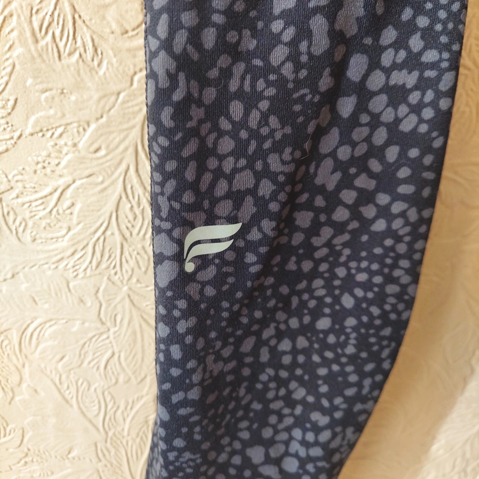 fabletics define powerhold® high-waisted 7/8 spotted animal leggings