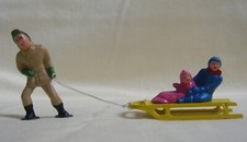 Man pulling sled w/children, Christmas Village or model train layout, New/Repro