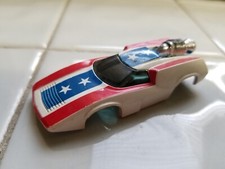 AFX Terrible turn on 1970s jet powered Evel Knievel slot car body