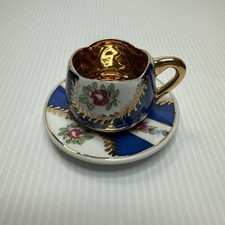 Royal porcelain miniature cup and saucer floral with gold embellishment EUC
