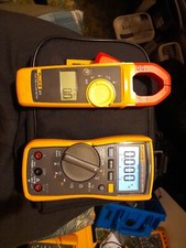 Fluke 117 Multimeter with Fluke 323 Clamp Meter and TL175 Test Leads + Case