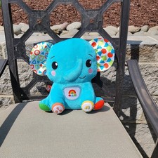 Fisher-Price Lights Learning Elephant Plush Interactive Musical Toy