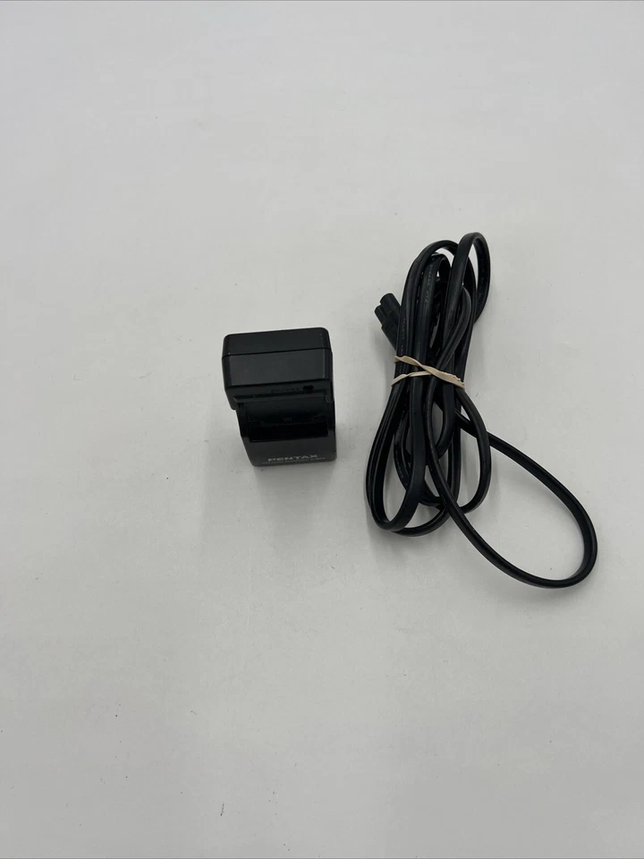 Cargador de batería Pentax D-BC8 genuino OEM para DL-18 Foto 2 de 4
