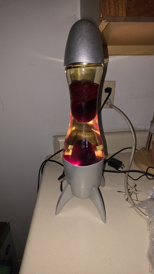 A 1990 Spencer's Rocket lava lamp — a specific, dated, genuinely vintage piece from the golden era of mall culture.