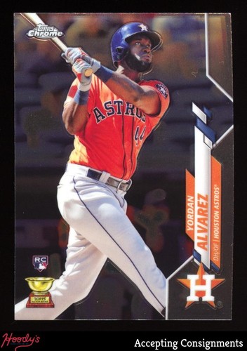 2020 Topps Chrome #200 Yordan Alvarez rookie card showing him in orange Astros jersey with white pants and RC logo.