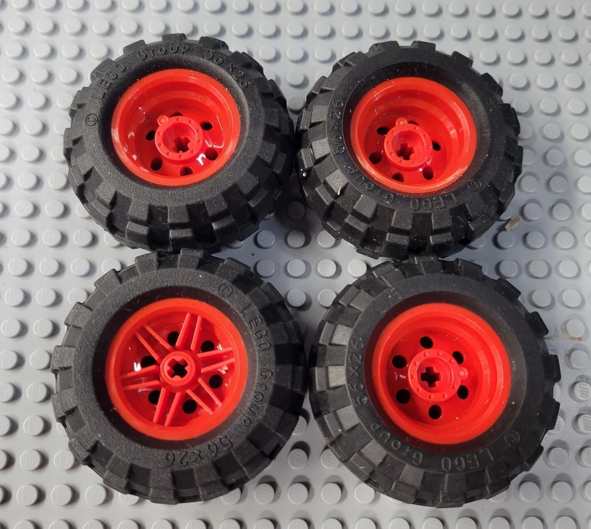 LEGO Lot of 4 Black 56x26 Tires with Red Technic Hubs
