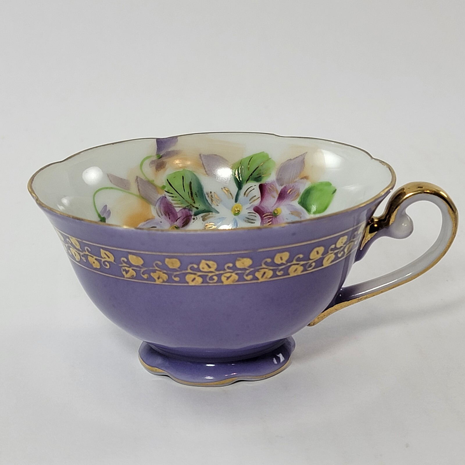 Saji made in Japan fancy China purple teacup with floral design and