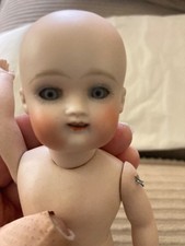 Antique Bisque Doll open/close eyes, open mouth with teeth, arms and legs move 