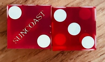 Pair of red vintage craps gaming gambling dice used at Suncoast Casino Las Vegas