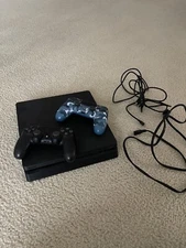 used black playstation 4 console