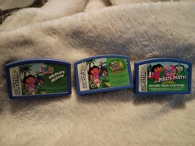Leapster games DORA the EXPLORER PINATA PARTY & WILDLIFE RESCUE & Animal Rescue