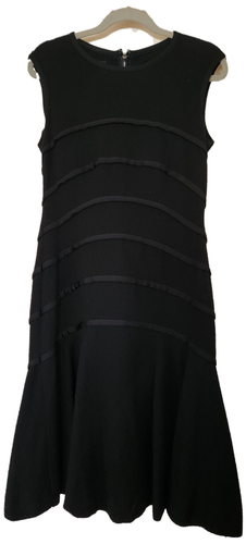 Escada black dress. size 8. interesting diagonal details. Form flattering Size 8