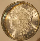 1885 Morgan silver Dollar - BU, frosty GEM with rainbow crescent toning obv 5261