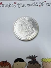 1887 Morgan silver dollar uncirculated and some toning
