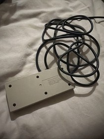 This image shows an original Nintendo Entertainment System (NES) controller