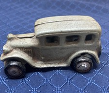 Small Cast Iron Painted Car with moveable wheels